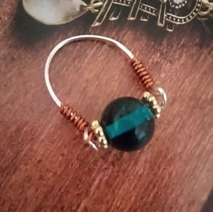 Wire wrapped  blue glass beaded 7in approx ring.